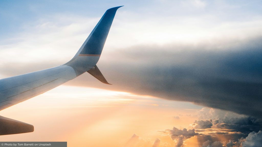 view from an aeroplane here you can see clouds and the wing